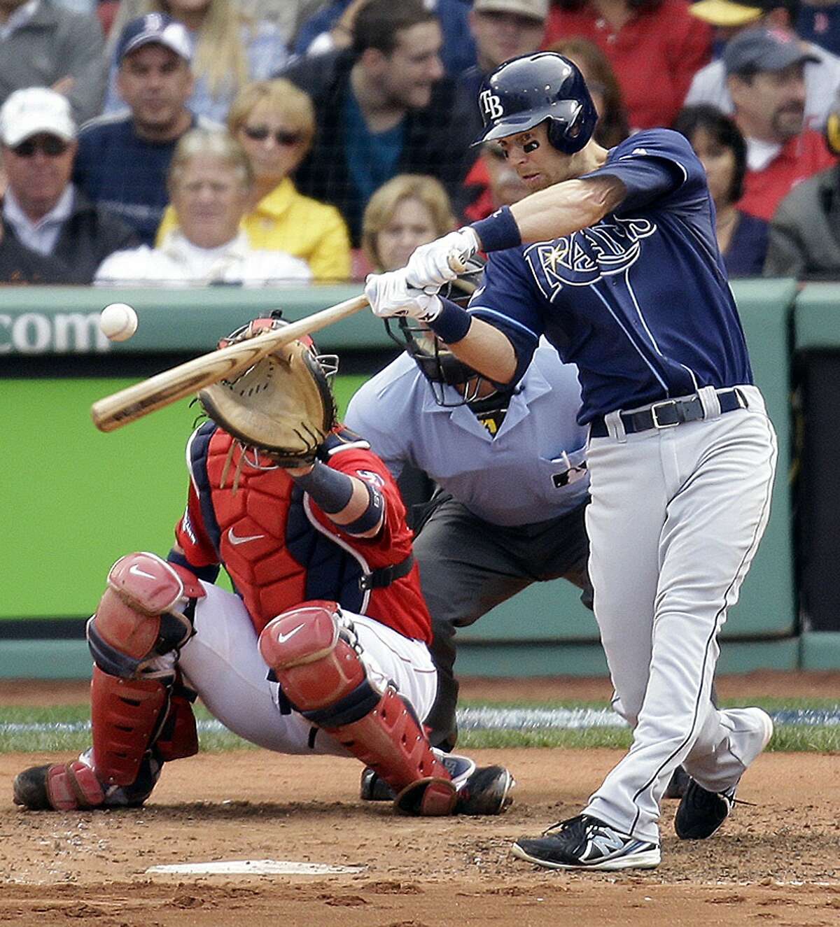 Tampa Bay Rays second baseman Ben Zobrist connects for a home run off Boston Red Sox starting pitcher Jon Lester, left, in front of Red Sox catcher Jarrod Saltalamacchia during the fourth inning of Game 1 of baseball's American League division series, Friday, Oct. 4, 2013, in Boston. (AP Photo/Stephan Savoia)