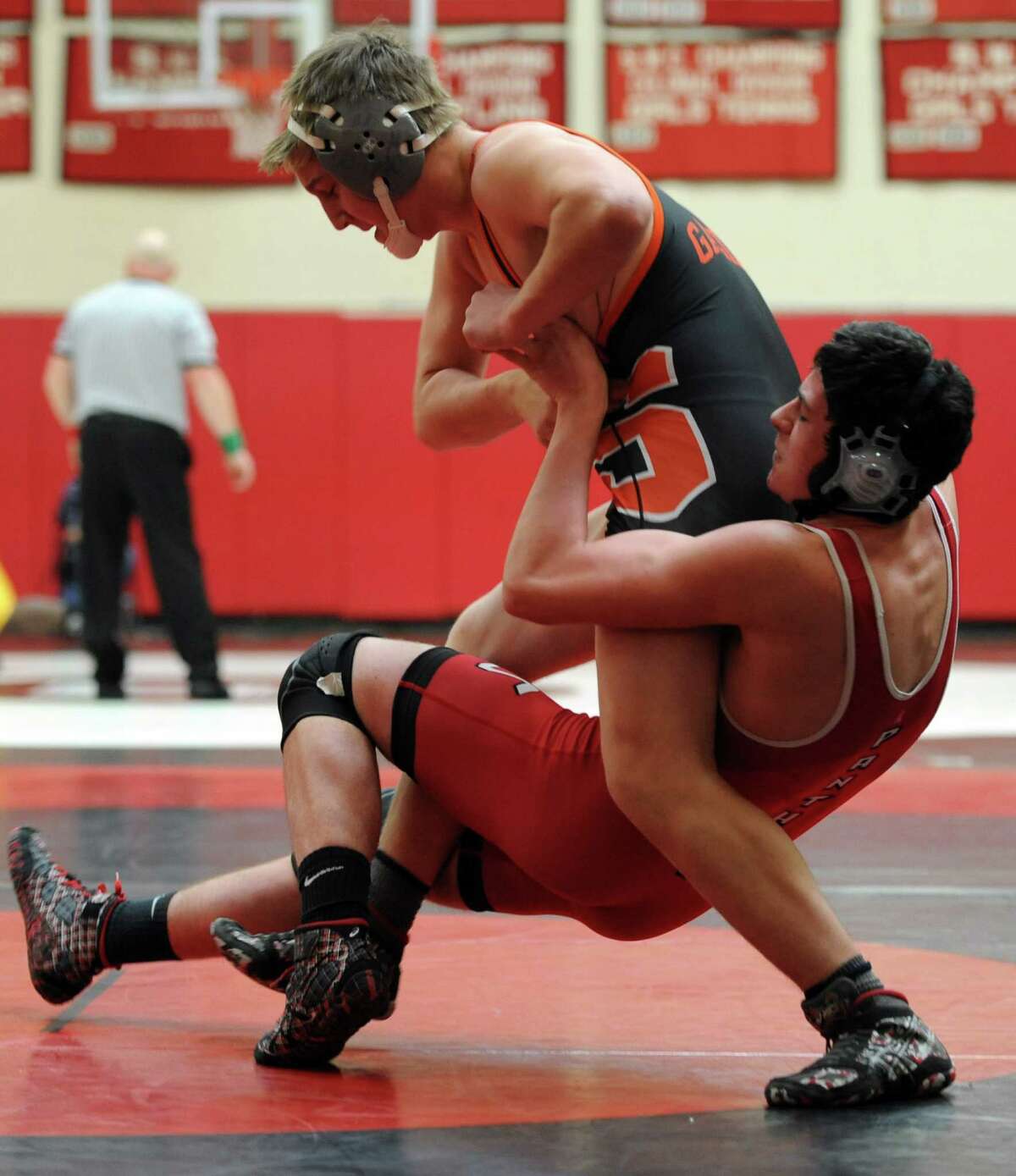 Shelton's Daniel Persson, left, and Masuk's Evan Patterson wrestle in the 160 lb. weight class Saturday, Jan. 10, 2015, during a tournament at Masuk High School in Monroe, Conn.