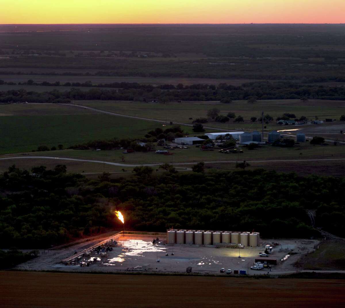 An oil production flare, also called a flare stack, is seen in a Wednesday, May 14, 2014 aerial image taken near Karnes City, Texas.