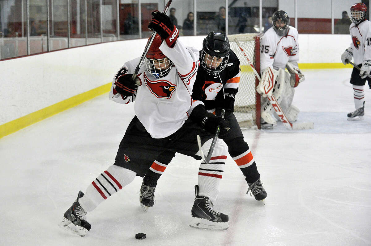 Greenwich's Colin Kelly and Stamford's Andrew Kydes battle for the puck during their hockey game at Dorothy Hamill Skating Rink in Greenwich, Conn., on Monday, Jan. 12, 2015. Greenwich won, 8-1.
