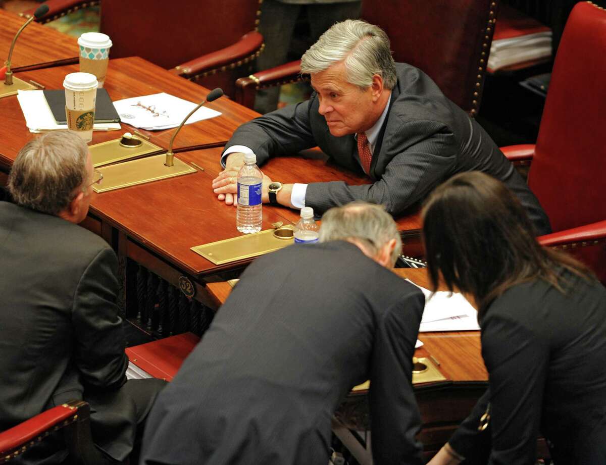 Senate majority leader Dean Skelos, right, confers with Sen. John DeFrancisco, R-Syracuse, left, during session Monday afternoon, Jan. 12, 2015, at the Capitol in Albany, N.Y. (Lori Van Buren / Times Union)