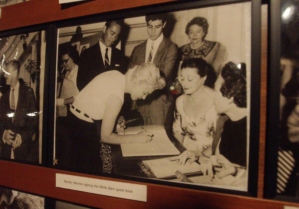 A New Canaan firm wants to develop a cluster of houses along the Westport-Norwalk line on a piece of property that was formerly the site of the legendary White Barn Theater. Among the stars who visited the White Barn, was Marilyn Monroe, seen here signing the theater's guestbook.