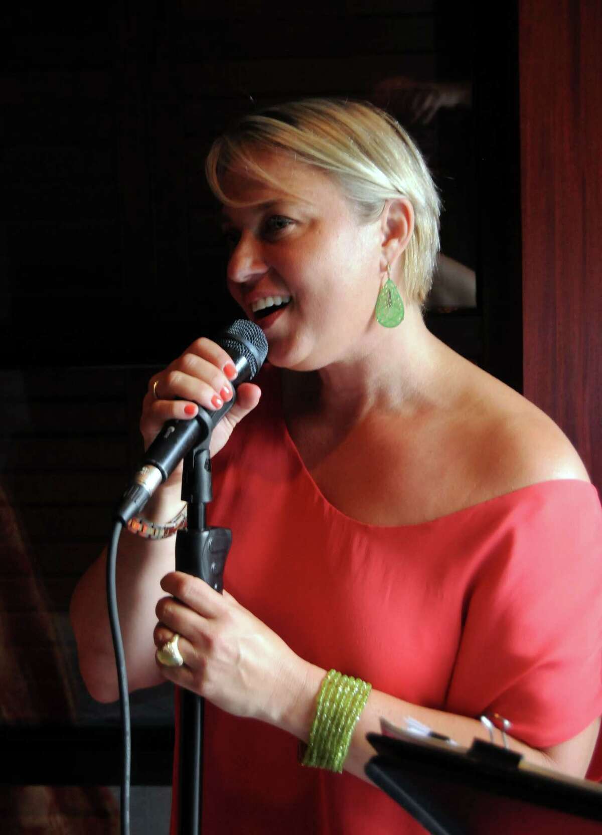 Kristine Mills sings at the annual Rose Ribbon Dinner at Fleming's Wednesday May 29, 2013.(Dave Rossman photo)