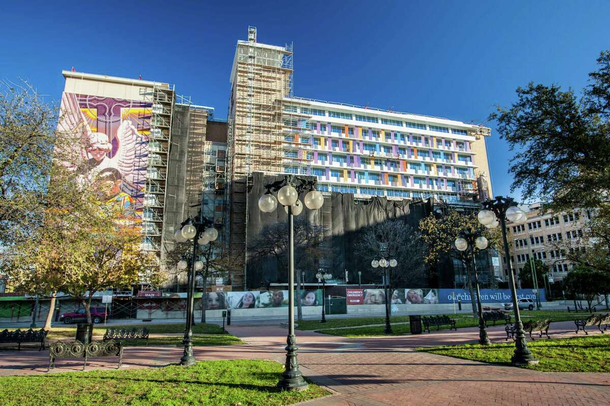 Colorful channel glass panels that take their color cues from Jesse Trevino's mural "Spirit of Healing" are being installed on the facade of Children's Hospital of San Antonio to create a more playful, childlike feel.