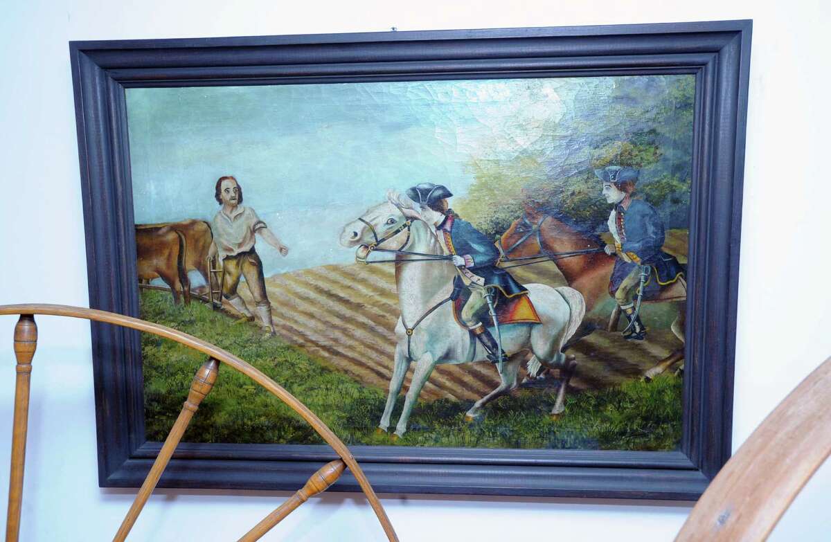 A painting of Gen. Israel Putnam's famous ride escaping from the British Army during the American Revolution hangs on the wall of historic Putnam Cottage at 243 E. Putnam Ave., Greenwich, Conn., Wednesday, Jan. 14, 2015. Greenwich is celebrating the 375th anniversary of its founding. On Sunday, Feb. 22, the Daughters of the American Revolution will provide a re-enactment at Putnam Hill Park featuring Gen. Israel Putnam's escape from invading British forces in 1779. Town officials will also rededicate Putnam Hill Park and there will be public tours of Putnam Cottage.
