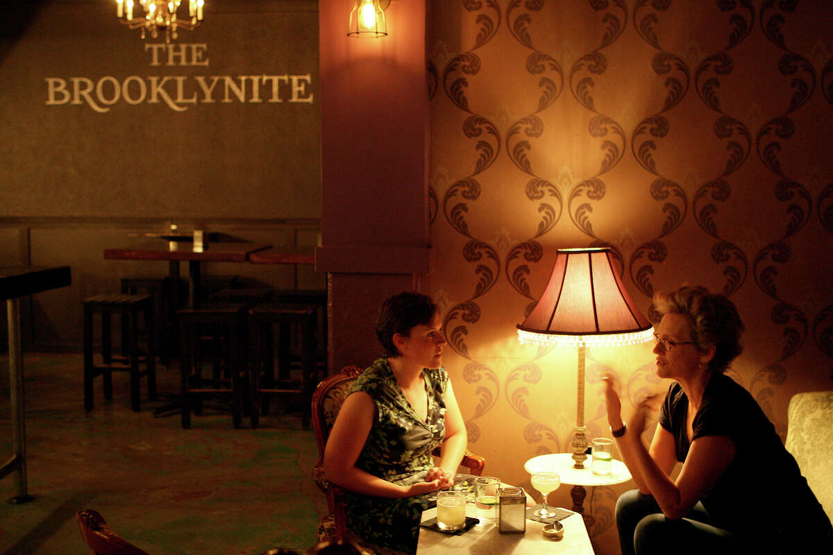 Chrissy Breit (left) and Christine Drennon talk inside The Brooklynite.