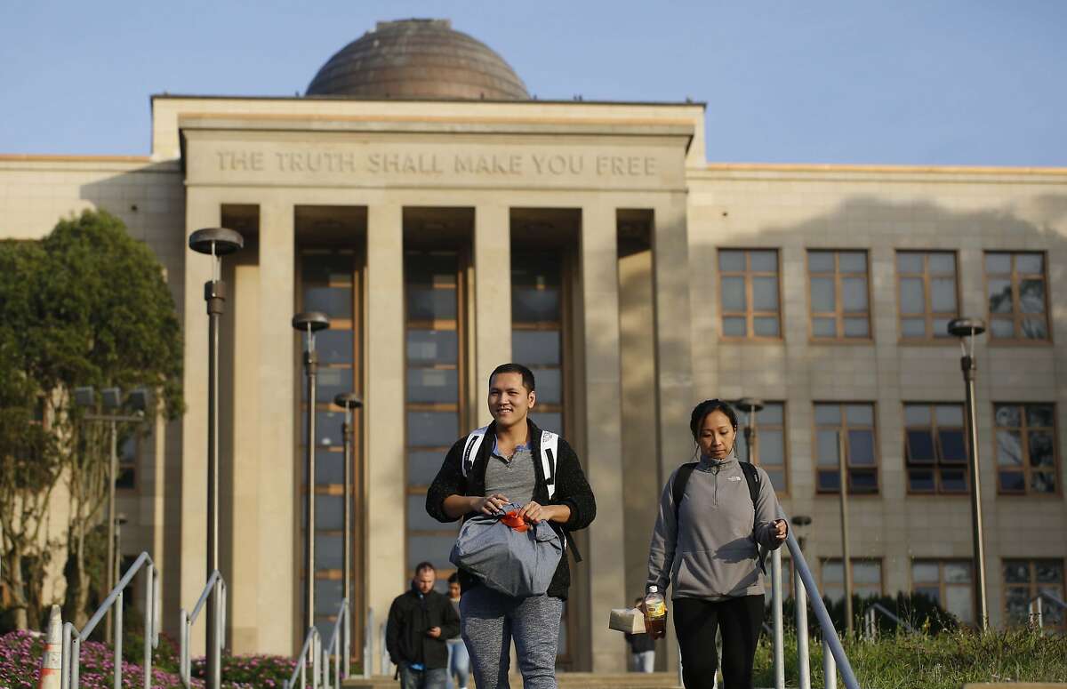 City College of San Francisco Nursing students Jesse Nguyen and Carina Zulueta leave class at the school's the main campus on Wednesday January 14, 2014 in San Francisco, Calif. The accrediting commission granted CCSF two more years to get everything in order to avoid losing accreditation.