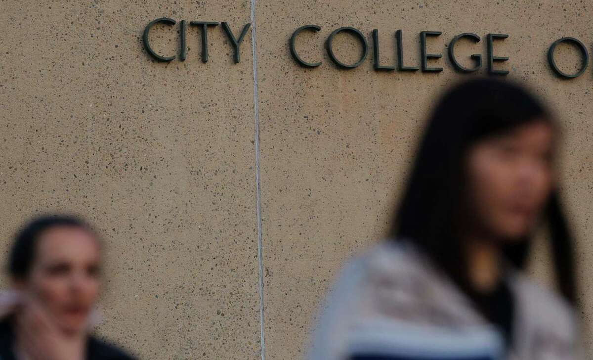 City College of San Francisco students Anastasia Bachykala and Rachel Li leave class at the school's the main campus on Wednesday January 14, 2014 in San Francisco, Calif. The accrediting commission granted CCSF two more years to get everything in order to avoid losing accreditation.