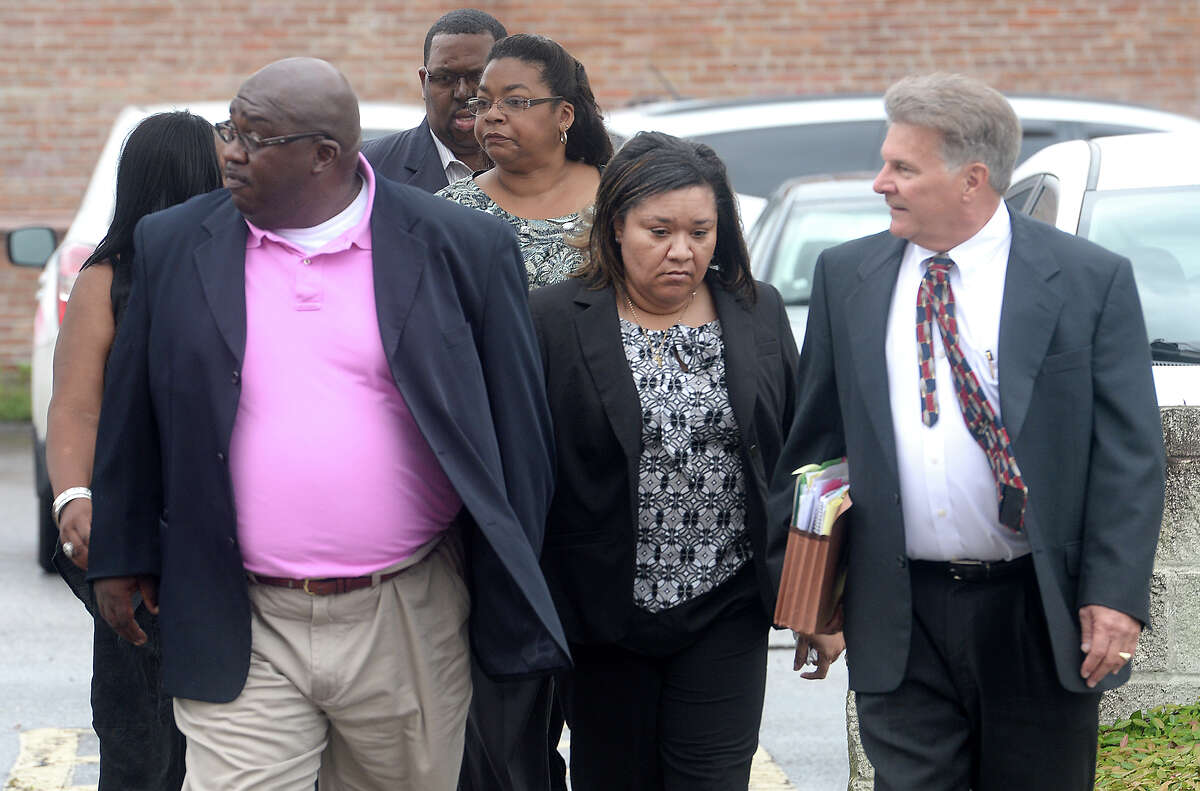 Flanked by family and her attorney, former BISD comptroller Sharika Allison (center) makes her way into the Federal Courthouse Thursday morning for her sentencing. Allison, along with former Chief Financial Officer Devin McCraney were indicted by a federal grand jury in January on 19 counts of conspiracy and fraud. The pair pled guilty in April. Photo taken Thursday, September 18, 2014 Kim Brent/@kimbpix