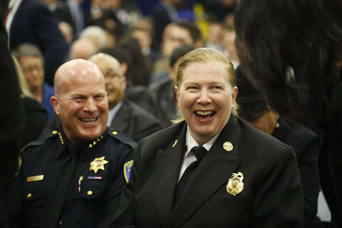 Police Chief Greg Suhr and Fire Chief Joanne Hayes-White sit next to each other as they wait for San Francisco Mayor Ed Lee to give his State of the City speech at the San Francisco Wholesale Produce Market on Thursday January 15, 2015 in San Francisco, Calif.