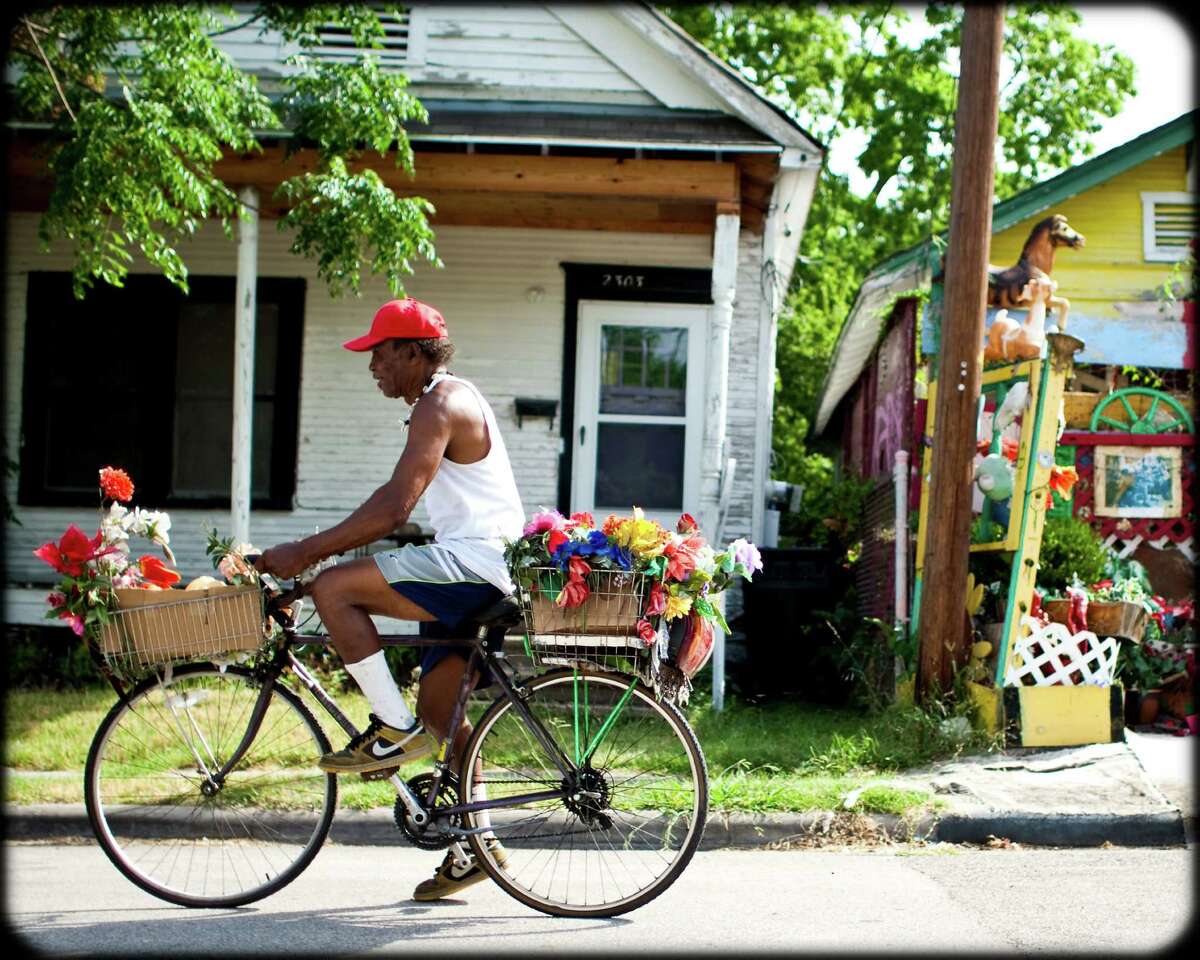 Cleveland Turner, also known as Flower Man, rode his bike in search of cast-off junk that he turned into art.
