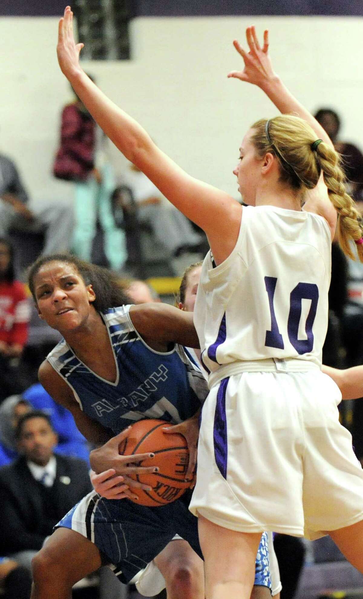 Albany's Mylah Chandler, left, works to get to the hoop as CCHS's Julia Engster defends during their basketball on Thursday, Jan. 15, 2015, at Catholic Central High School in Troy, N.Y. (Cindy Schultz / Times Union)