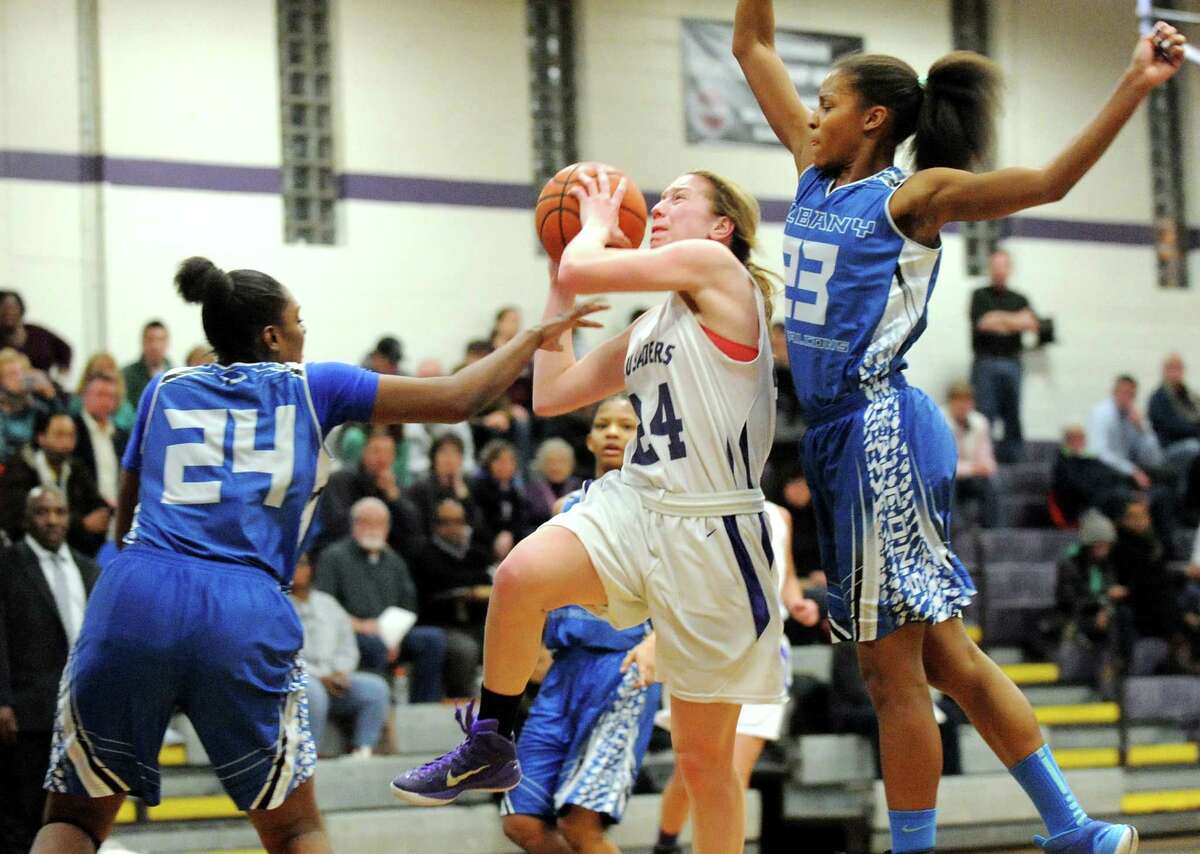 CCHS's Taylor Engster, center, goes to the hoop as Albany's Shayona Foulks, left, and Mylah Chandler defend during their basketball on Thursday, Jan. 15, 2015, at Catholic Central High School in Troy, N.Y. (Cindy Schultz / Times Union)