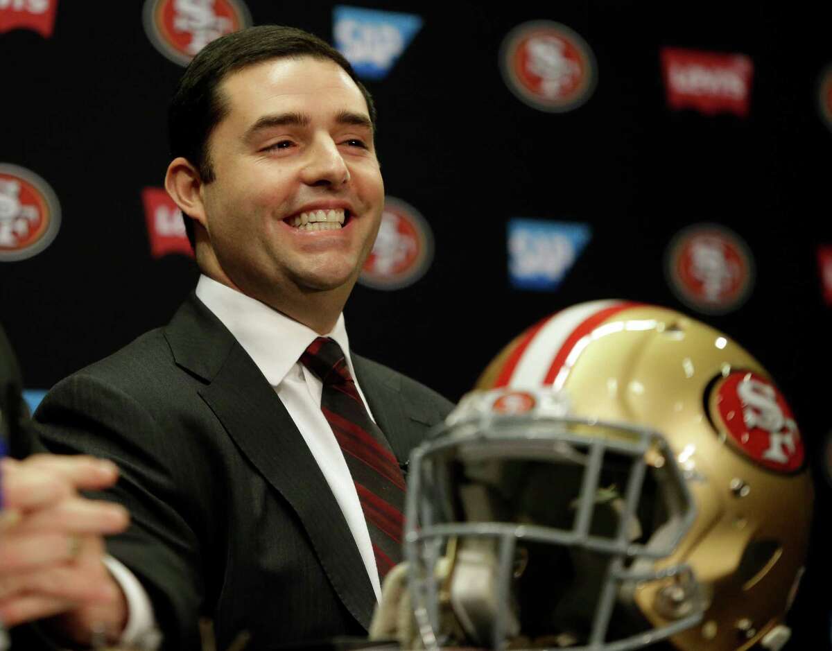 Niners CEO Jed York reacts during a press conference to announce the promotion of Jim Tomsula to head coach. York spoke Friday in Arizona about how the offense, and quarterback Colin Kaepernick in particular, could be much improved next season.