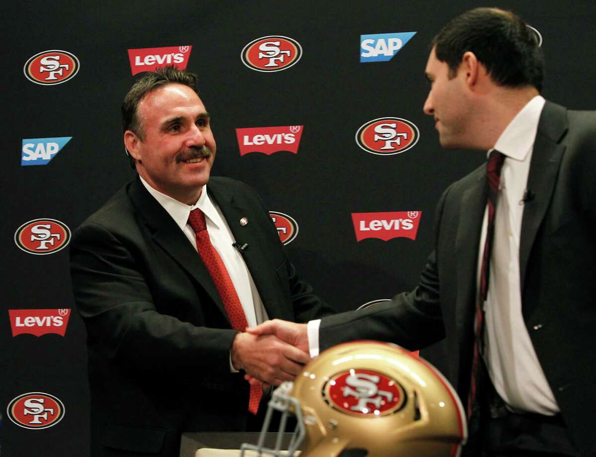 Jim Tomsula shakes hands with team CEO Jed York after Tomsula is introduced as the new head coach of the San Francisco 49ers during a press conference at Levi's Stadium in Santa Clara, Calif. on Thursday, Jan. 15, 2015.