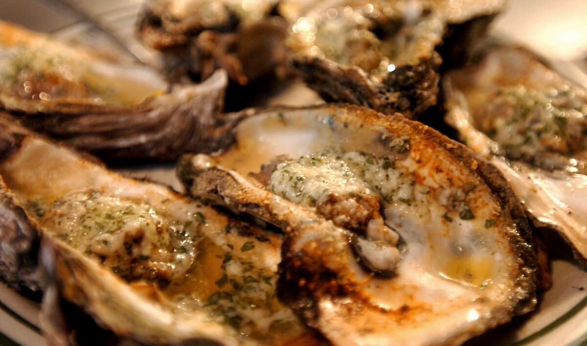 Flame grilled oysters are available at Floyd's in Beaumont, Tuesday, January 4, 2012. Tammy McKinley/The Enterprise