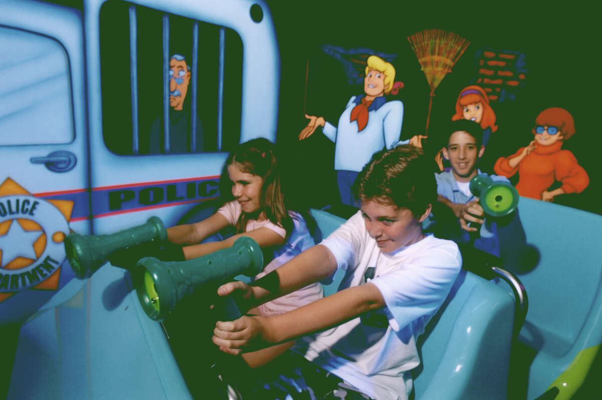 Six Flags Fiesta Texas visitors aim for ghosts and other scary targets at Scooby-Doo Ghostblasters.