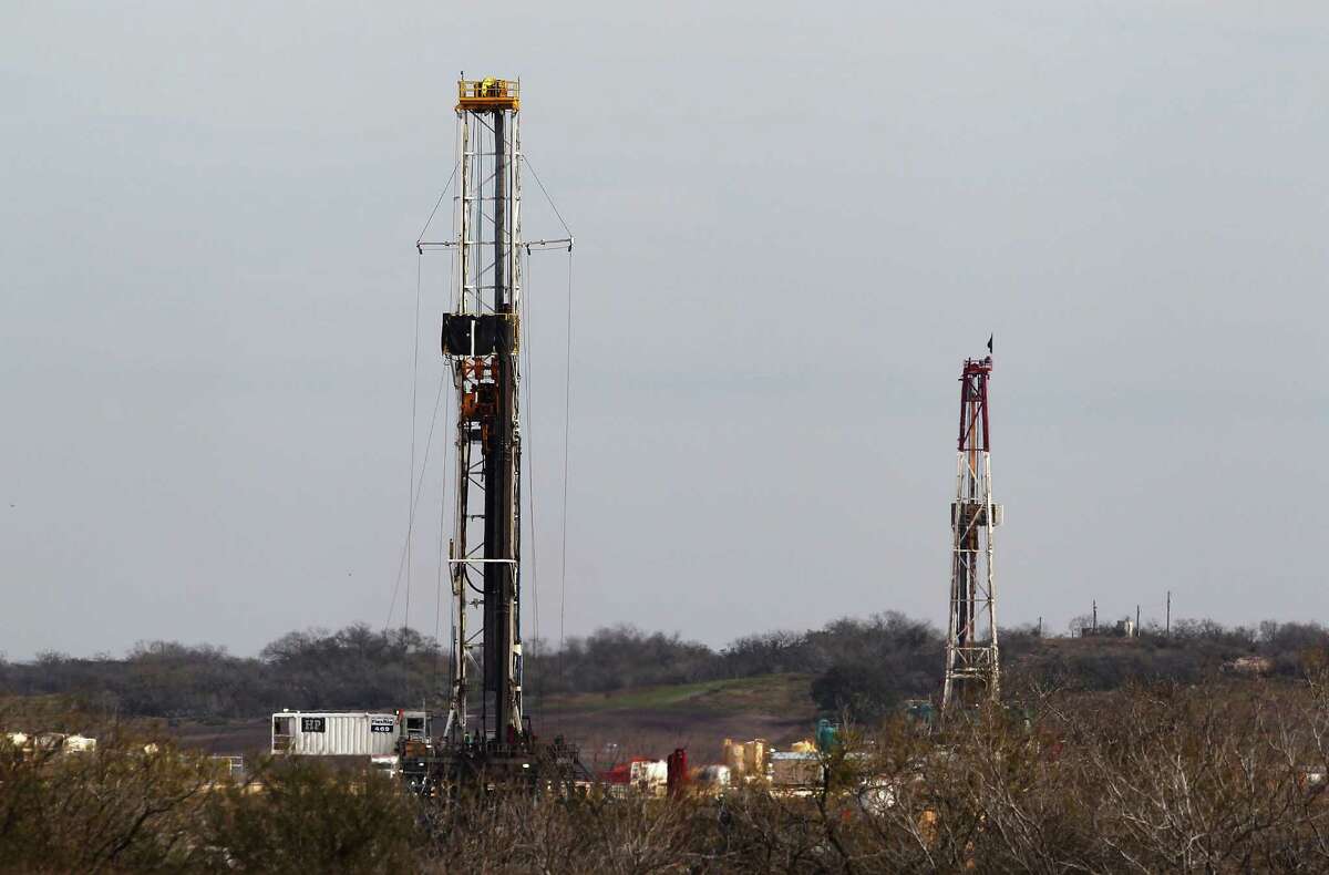 A pair of oil rigs are seen near Karnes City. Karnes County is considered the heart of the field — it produces more oil than any other spot in Texas.