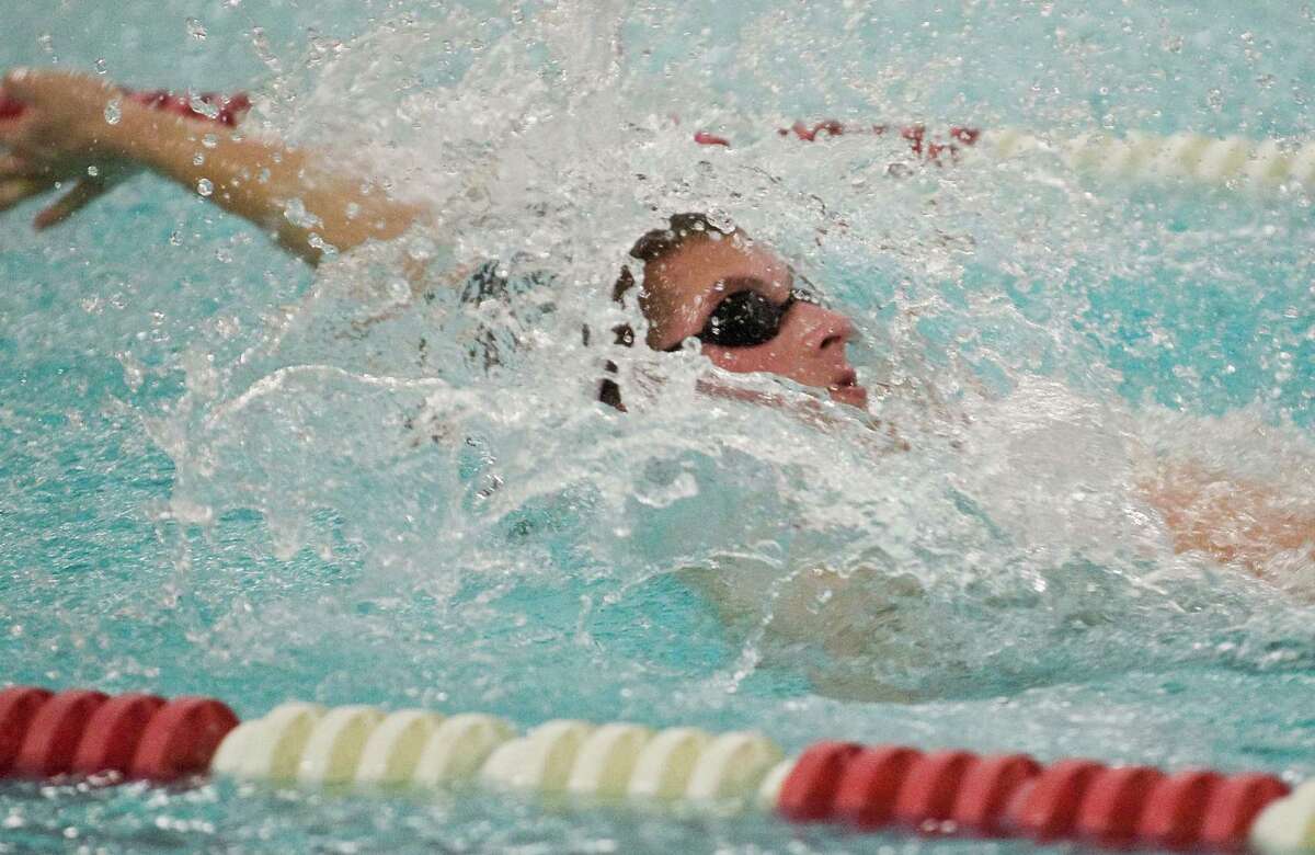 Pomperaug High School's John O'Neill swims the breaststroke in the 200 Medley Relay during a meet against Brookfield High School held at Pomperaug. Friday, Jan. 16, 2015