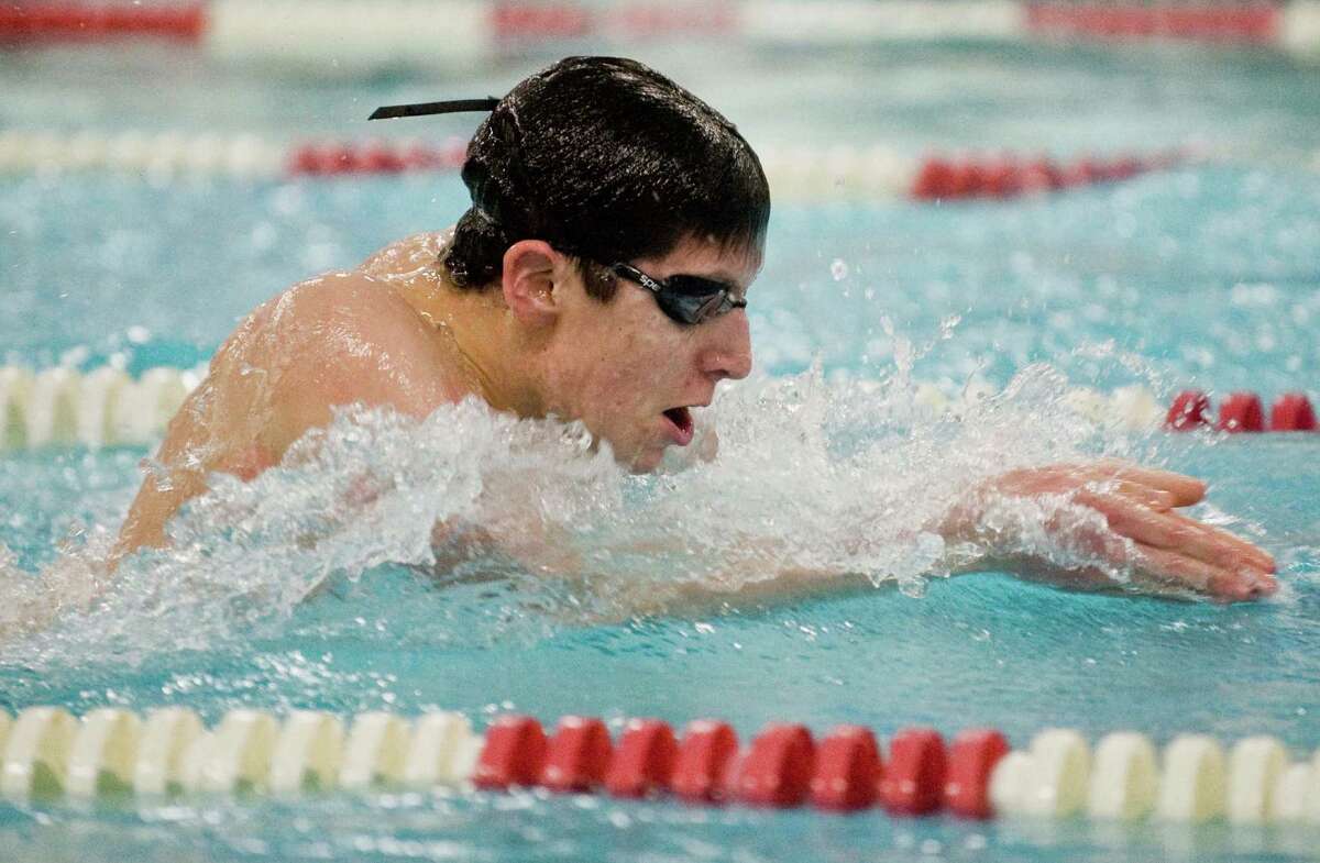 Pomperaug High School's Dominic Papiro swims the breaststroke in the 200 Medley Relay during a meet against Brookfield High School held at Pomperaug. Friday, Jan. 16, 2015