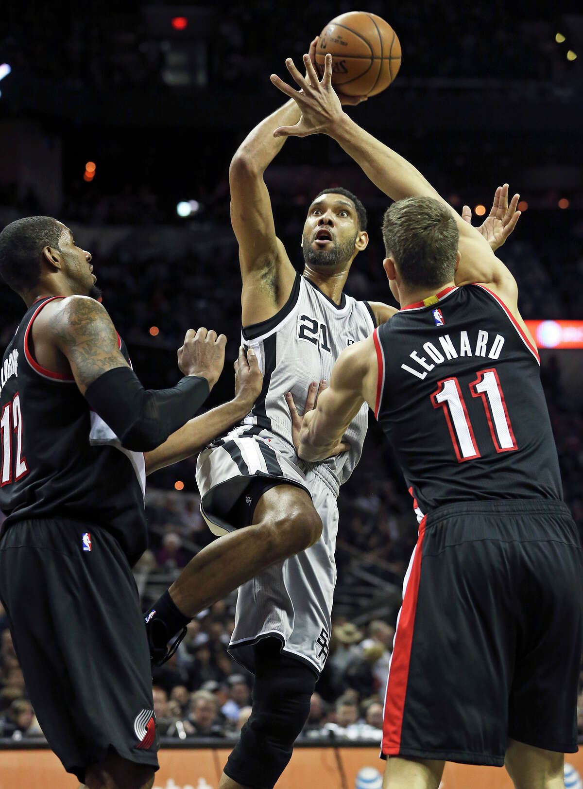 Tim Duncan falls back for a shot in the lane as the Spurs play the Portland Trailblazers at the AT&T Center on January 16, 2015.