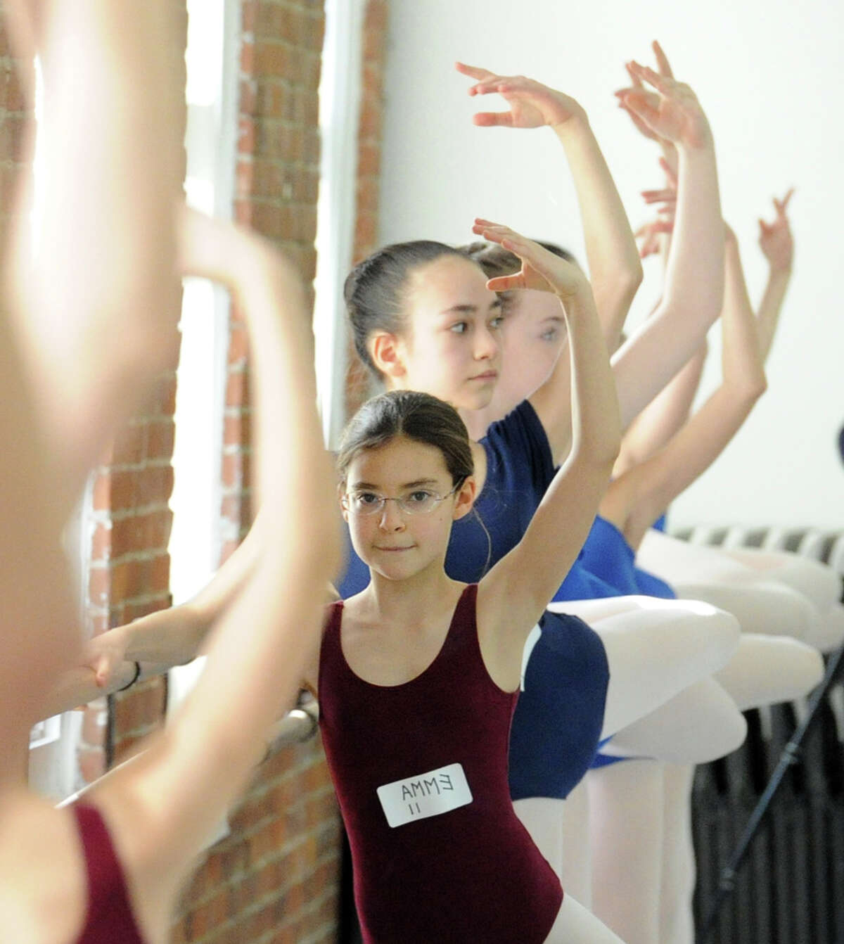 Center, 11-year-old Emma Kornberg of Greenwich, during auditions for the Greenwich Balllet Academy at the academy in Port Chester, NY, Saturday morning, January 17, 2015. Marisol Rivera-Thurman, president and chair of the board of administration of Greenwich Ballet Academy, says the academy both provides pre-professional training and encourages young dancers to reach their maximum potential in classical ballet or contemporary dance. Rivera-Thurman said girls trying out for the academy will be notified in a few weeks if they've been selected.