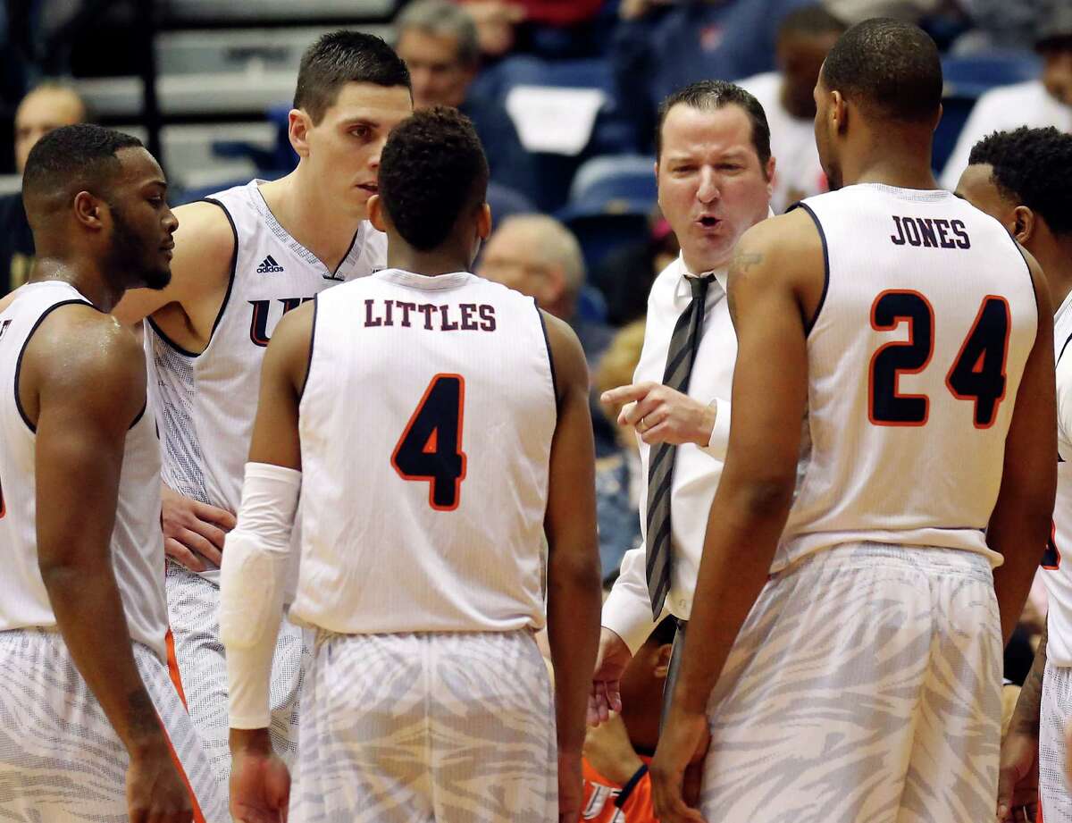 UTSA head coach Brooks Thompson (center) talks with the team during a timeout in second half action against UTEP on Jan. 17, 2015 at the Convocation Center.