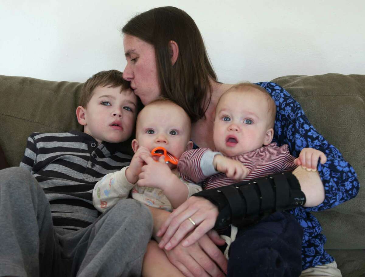 Linnea Rich with her three sons, Colin (left), and twins Andrew and Nathan, at their home in San Rafael. Linnea says those who don’t vaccinate their kids put others at risk.