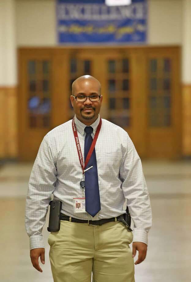 Kiante Jones, has been named principal of Notre Dame-Bishop Gibbons school in Schenectady. Among other previous positions, he has served as principal of Mont Pleasant Middle School, also in Schenectady, N.Y., where he is pictured walking through the schools's hallways on Wednesday morning, Oct. 22, 2014.  (Skip Dickstein/Times Union) Photo: SKIP DICKSTEIN / 00029164A