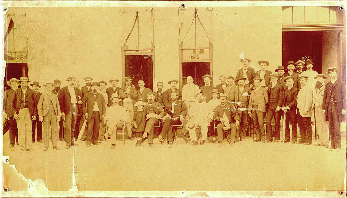 While not a photograph from an inauguration, this undated photograph from the 1880s shows several high ranking Texas officials in front of the temporary Capitol, hastily constructed while the current edifice was being built. Seated L to R: comptroller John D. McCall, House Speaker L.L. Foster, Governor Ireland, Supreme Court clerk Charles S. Morse, and Senate doorkeeper A.J. Dorn. [Photo: Texas State Library and Archives Commission]