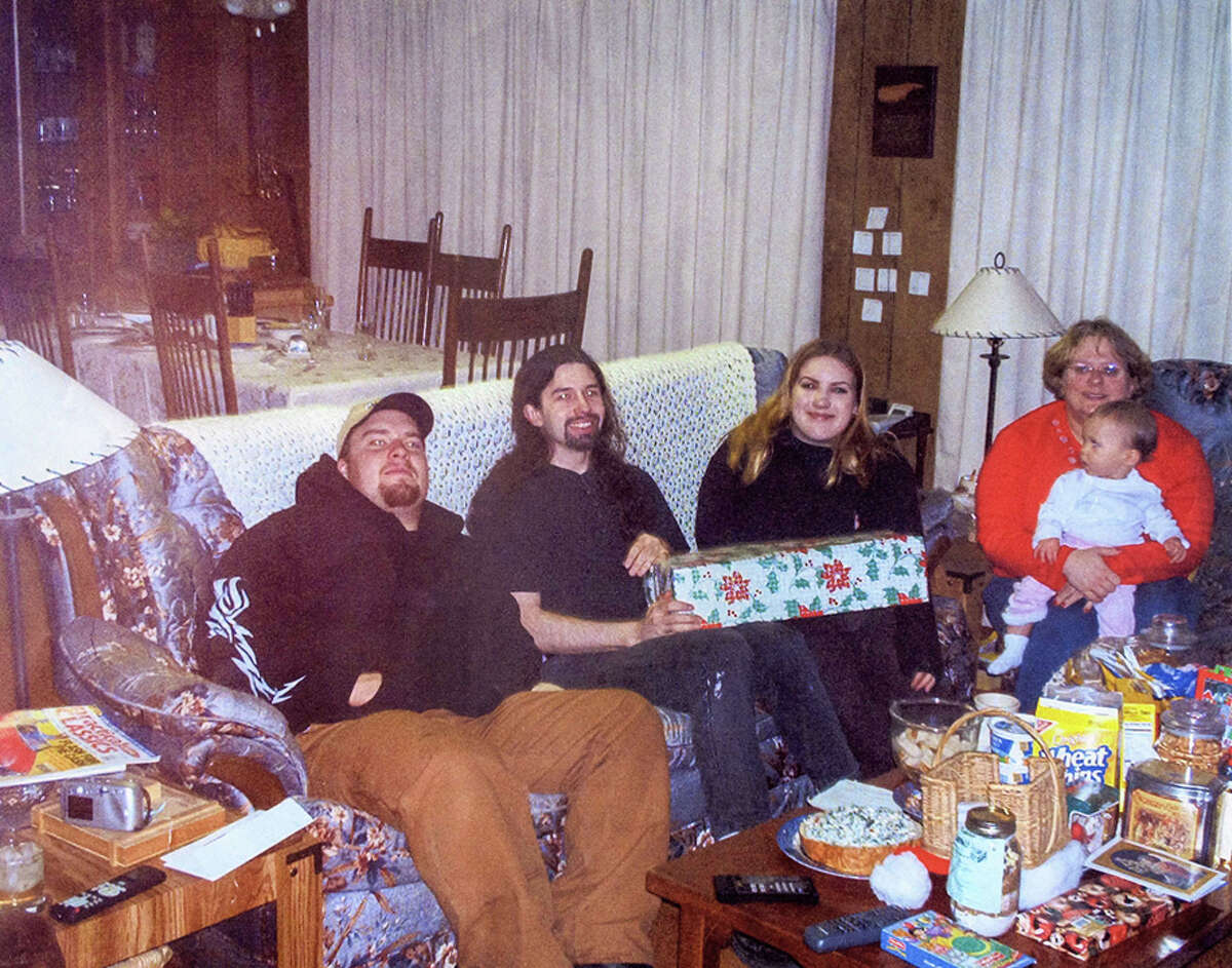 From left to right: Scott Anderson, Joseph McEnroe, Michele Anderson, Olivia Anderson and Erica Mantel Anderson, pictured in a 2002 family photo. McEnroe and Michele Anderson are accused of killing Scott Anderson and Erica Mantle Anderson, as well as the couple's daughter Olivia and son Nathan.