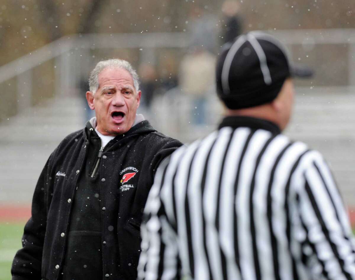 Greenwich High School football coach Rich Albonizio hollars at a referee during the Thanksgiving Day high school football game between Greenwich High School and Staples High School at Greenwich, Conn., Thursday, Nov. 27, 2014. Staples defeated Greenwich by a score of 38-21.