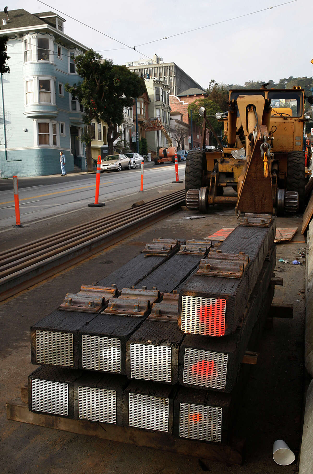 Railroad ties are stacked near Duboce and Noe streets, where the project could be shut down until mid-March.
