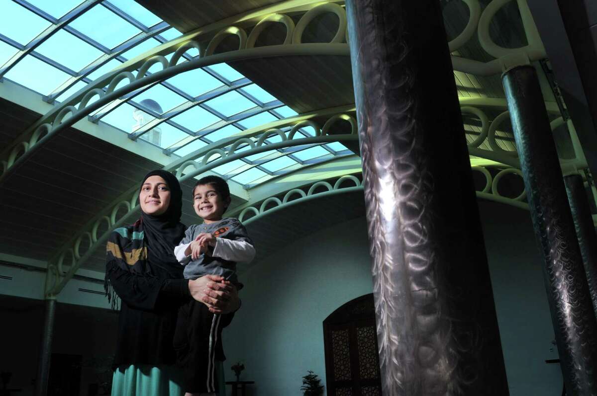 Uzma Popal holds her son, Yusuf Popal, 3, inside the Al-Hidaya Center, Islamic Community Center of Troy & Latham on Thursday, Jan. 15, 2015, in Latham, N.Y. Uzma is the current coordinator of the MSKP, which has been in existence since 2003. (Paul Buckowski / Times Union)