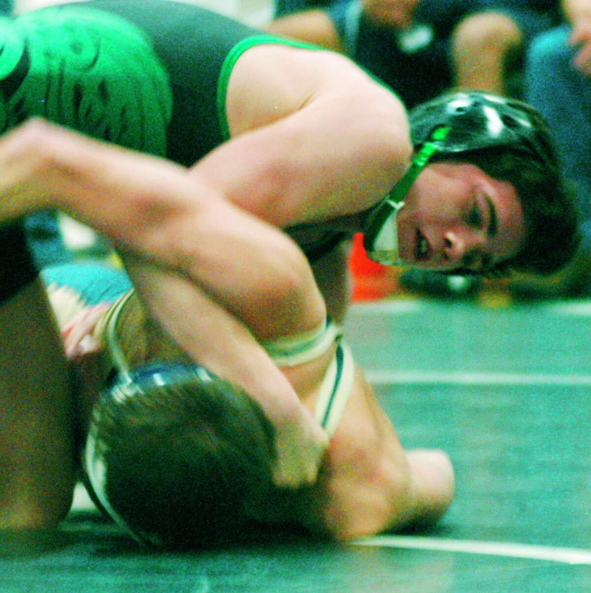 The highly skilled Kyle Lindner of the Green Wave dispatches Joey Briganti of Newington at 1:07 of their 120-pound semifinal match during the New Milford High School wrestling invitational at NMHS, Jan. 17, 2015.