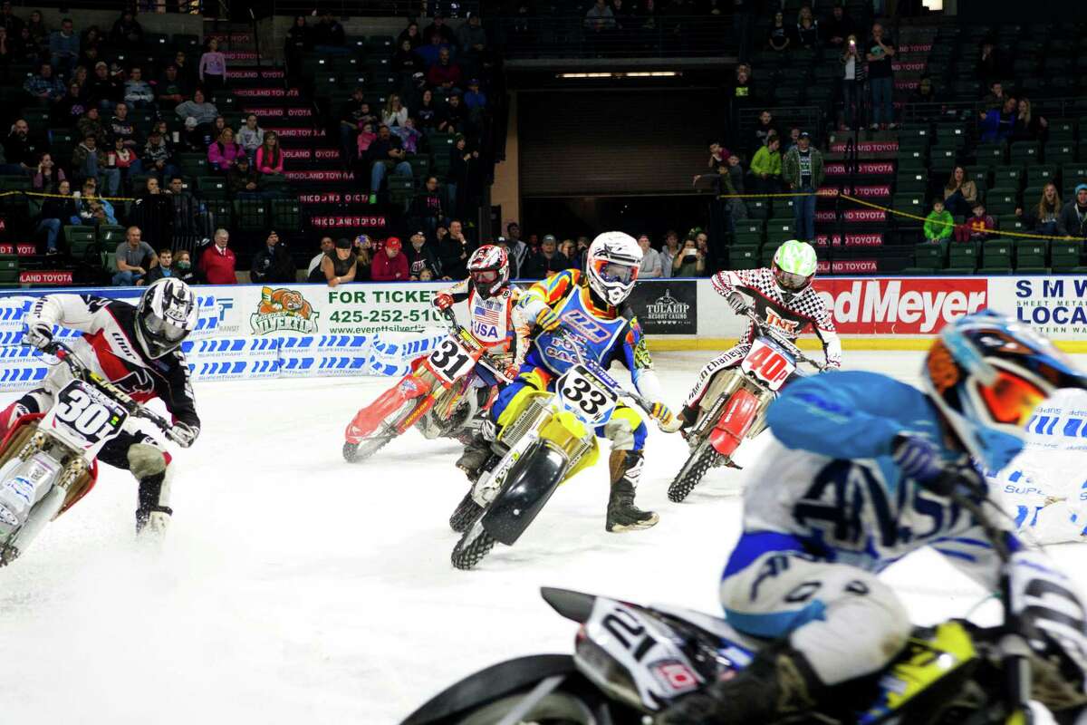 Local and international riders took to the ice to race their motorcycles, quads, three-wheelers, and go-karts at the X-treme International Ice Racing competition on Saturday, January 24, 2015 at the Xfinity Arena in Everett, Wash.