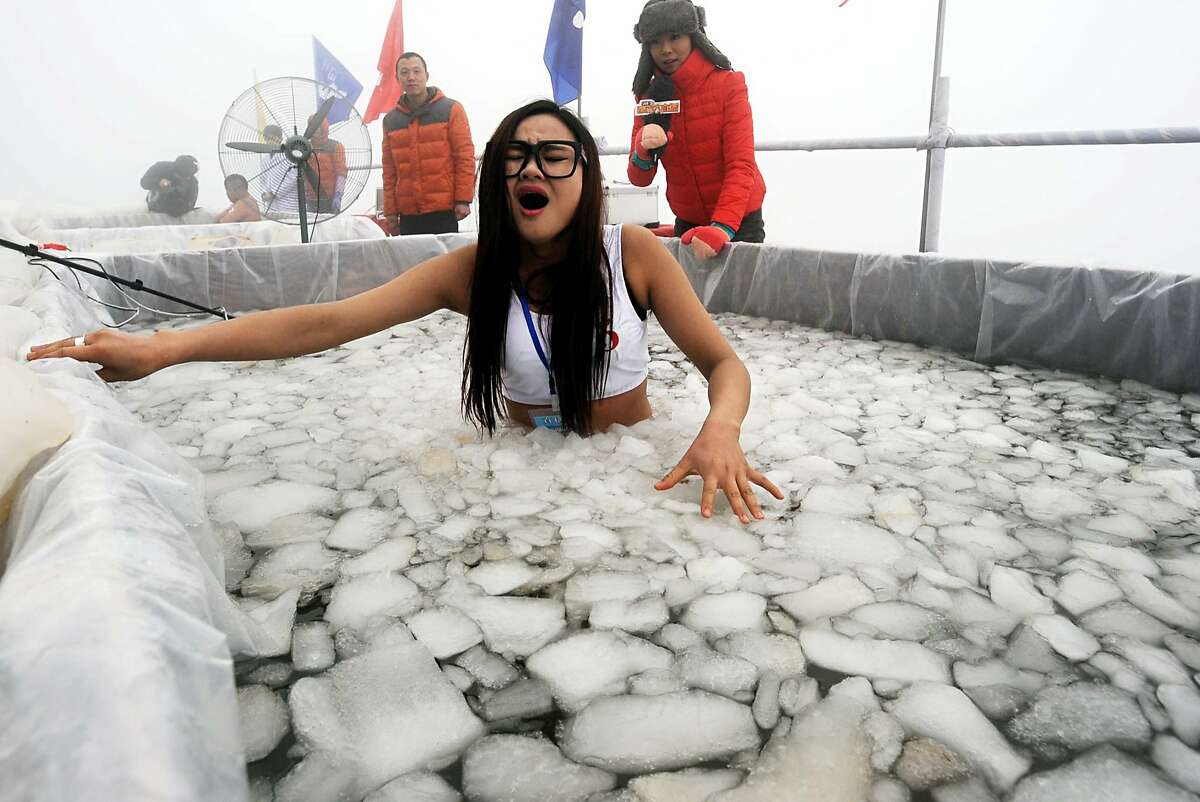 AND THE WINNER OF THE HYPOTHERMIA CHALLENGE IS ... Not her. A man named Chen Kecai outlasted all challengers in a cold endurance contest on Zhangjiajie's Tianmen Mountain in central China. He spent 64 minutes in the ice water.