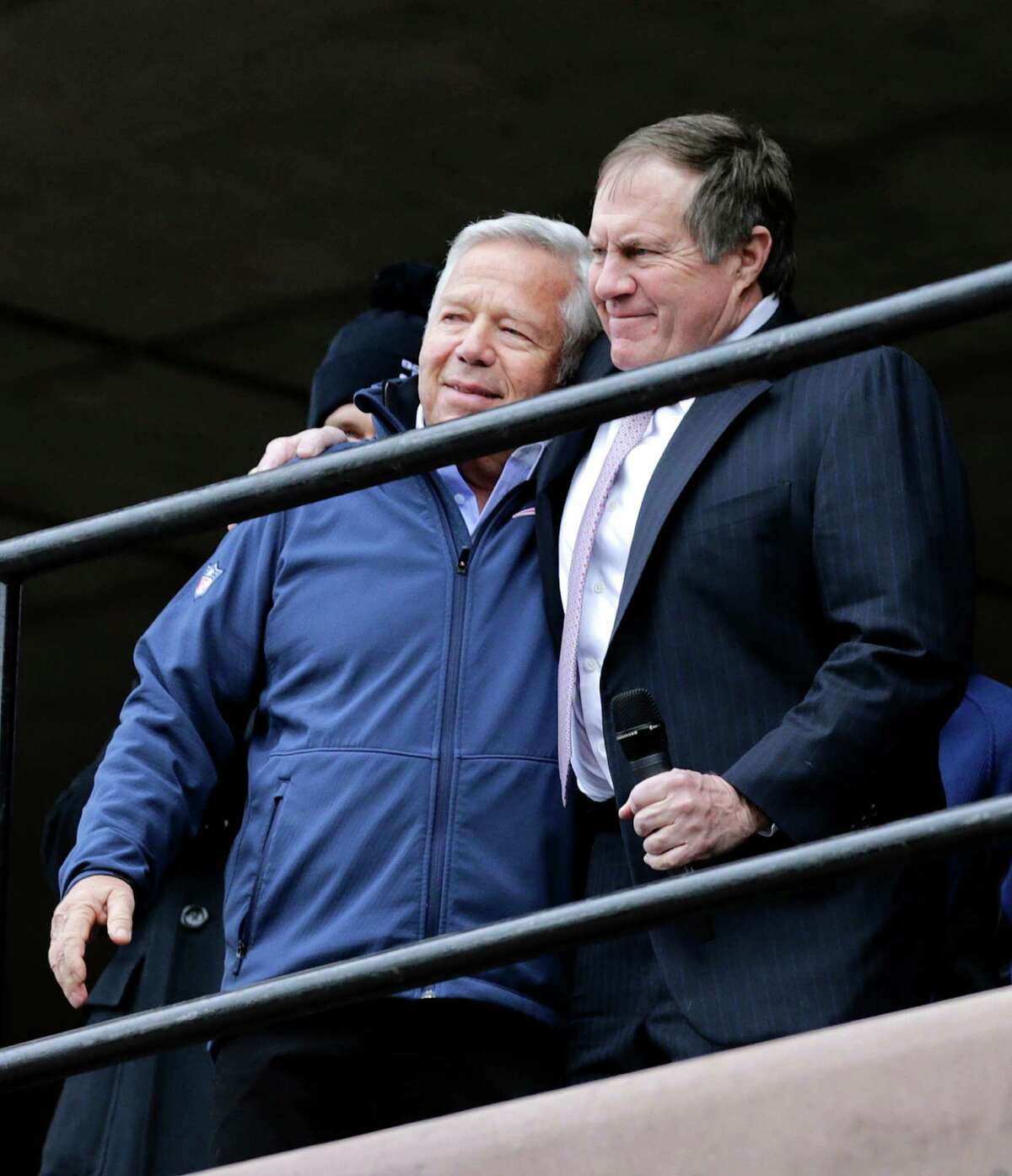 New England Patriots head coach Bill Belichick, right, embraces team owner Robert Kraft during an NFL football send-off rally at City Hall in Boston Monday, Jan. 26, 2015. The Patriots play the Seattle Seahawks in Sunday's Super Bowl XLIX in Glendale, Ariz. (AP Photo/Charles Krupa) ORG XMIT: MACK103