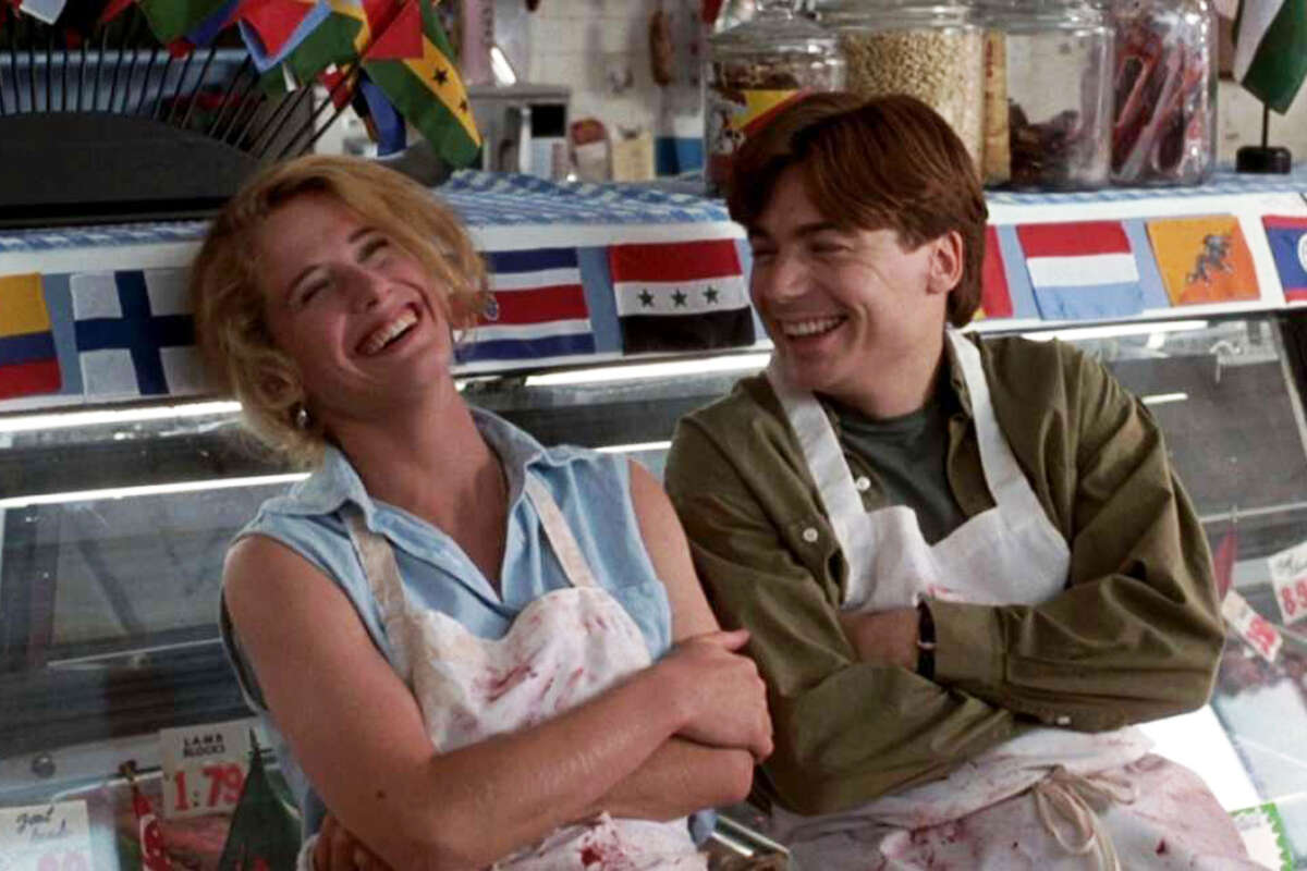 Actress Nancy Travis, left, and Mike Myers are seen inside the San Francisco butcher shop, R. Iacopi and Sons, for a scene from the film, "So I Married an Axe Murderer."