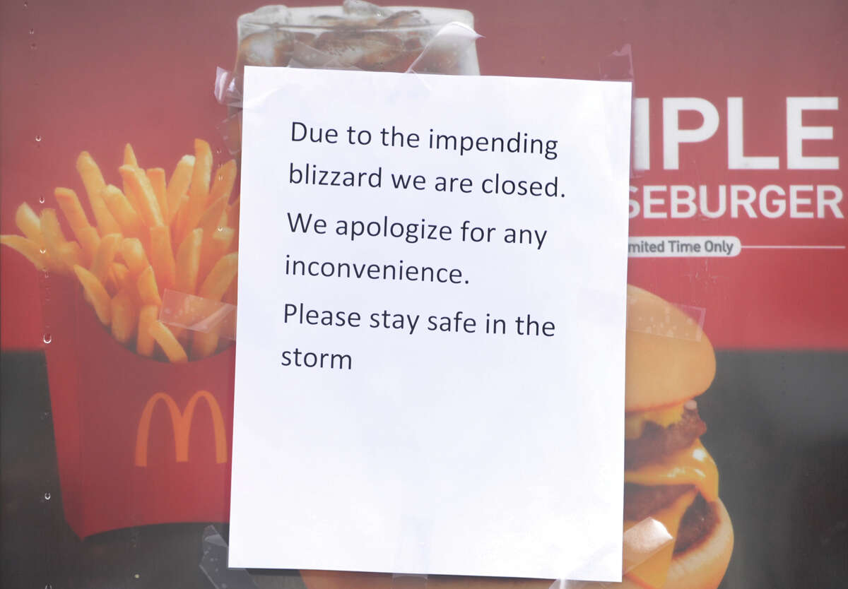 A closed for the storm sign on the McDonald's restaurant on the Post Road of I-95 exit 34 in Milford, Conn. on Tuesday, January 27, 2015.