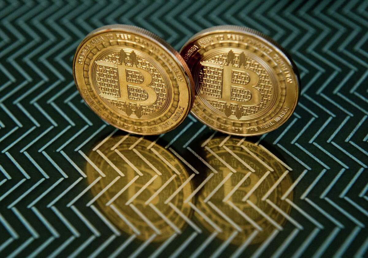 (FILES)This June 17, 2014 file photo taken in Washington, DC shows bitcoin medals. Bitcoin wallet operator Coinbase announced January 26, 2015 it opened the first regulated US exchange for the alternative currency. The opening could provide a boost to the cryptocurrency which has been hit hard by concerns about links to illegal activities and the collapse of a major bitcoin exchange last year. "With this launch our goal is to bring increased stability to the bitcoin ecosystem," Coinbase said in a blog post. Launched in 2009 by a mysterious computer programmer, bitcoin is a form of e-money that offers a largely anonymous payment system and can be stored either virtually or on a user's hard drive. AFP PHOTO / Karen BLEIERKAREN BLEIER/AFP/Getty Images