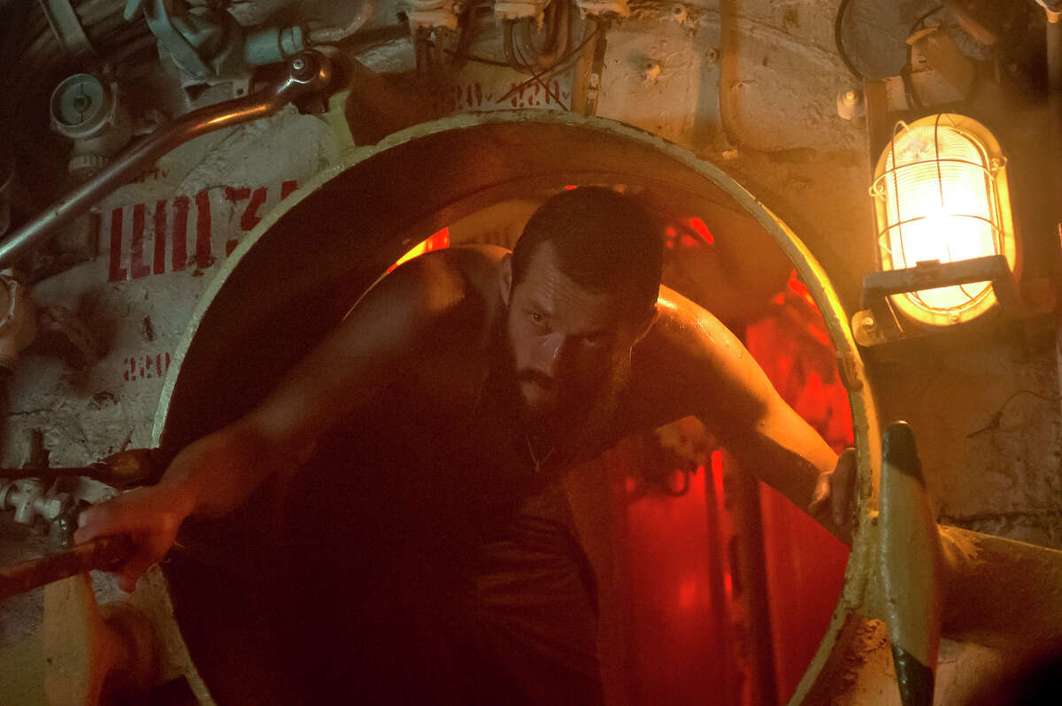 Jude Law, above, stars as a rogue submarine captain on the hunt for sunken treasure in “Black Sea.” At left, the sub embarks on the search for millions in gold bullion lost during World War II in the depths of the Black Sea.