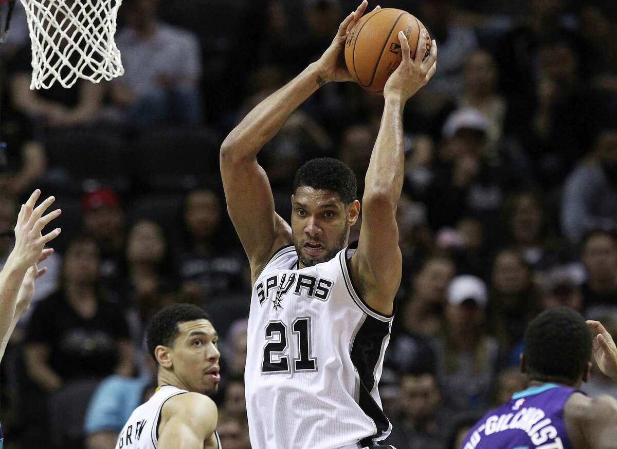 Tim Duncan of the San Antonio Spurs grabs the rebound against