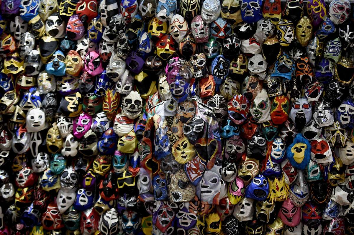 HINT, HE LOOKS A LITTLE BLUE: Can you find Chinese performance artist Liu Bolin standing among dozens of masks in the lobby of the Presidente Intercontinental Hotel in Mexico City?