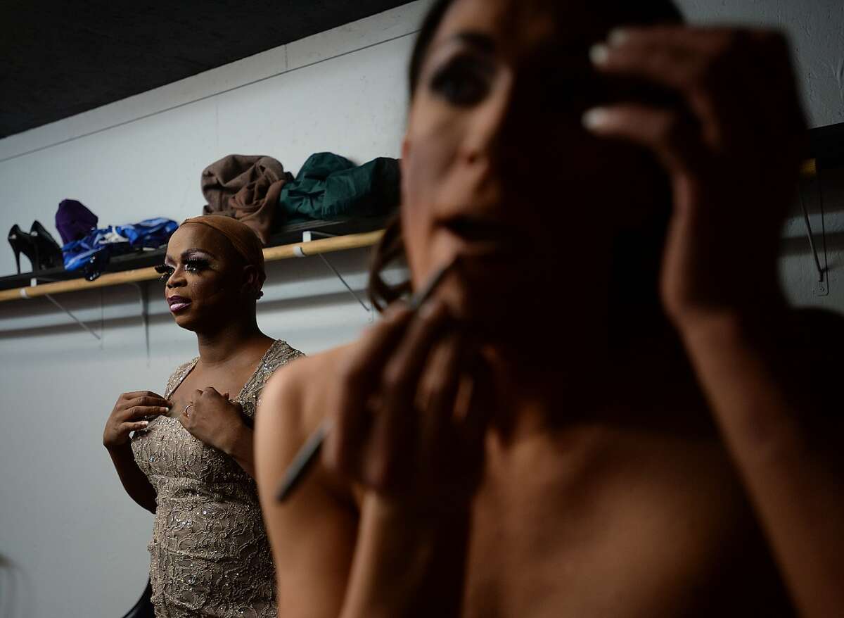Miss Louisiana USA Erica Matthews of Lake Charles (right) and Miss Texas USA Adeciya Iman of Houston and other performers get ready for Friday night's drag show backstage at Fame, Beaumont's newest gay club, which opened in the location formerly occupied by the Orleans Street Pub & Patio. Photo taken Friday, January 9, 2015 Kim Brent/The Enterprise