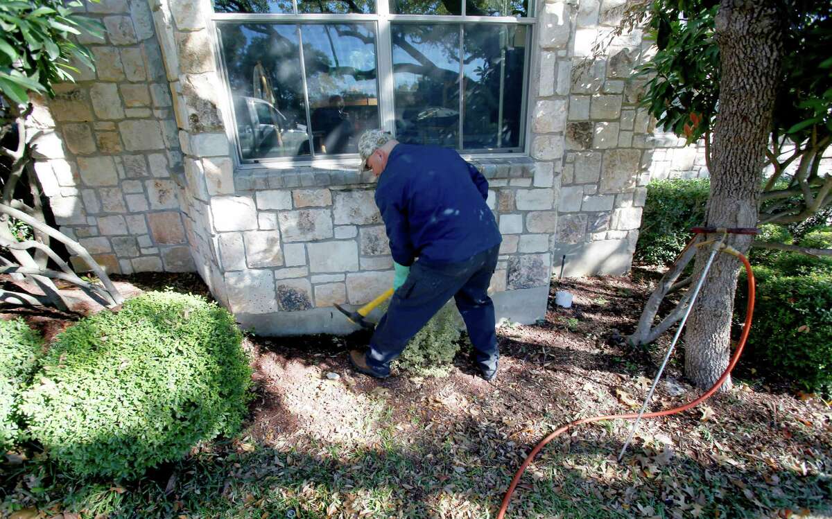 Randy Barnes, a termite certified pest technician with Bob Jenkins Pest & Lawn Services demonstrates the termite treatment process Tuesday, Jan. 27, 2015 at a far north side home. Authorities say late February through May is when termites most frequently surface, sometimes called swarming, in Central Texas.