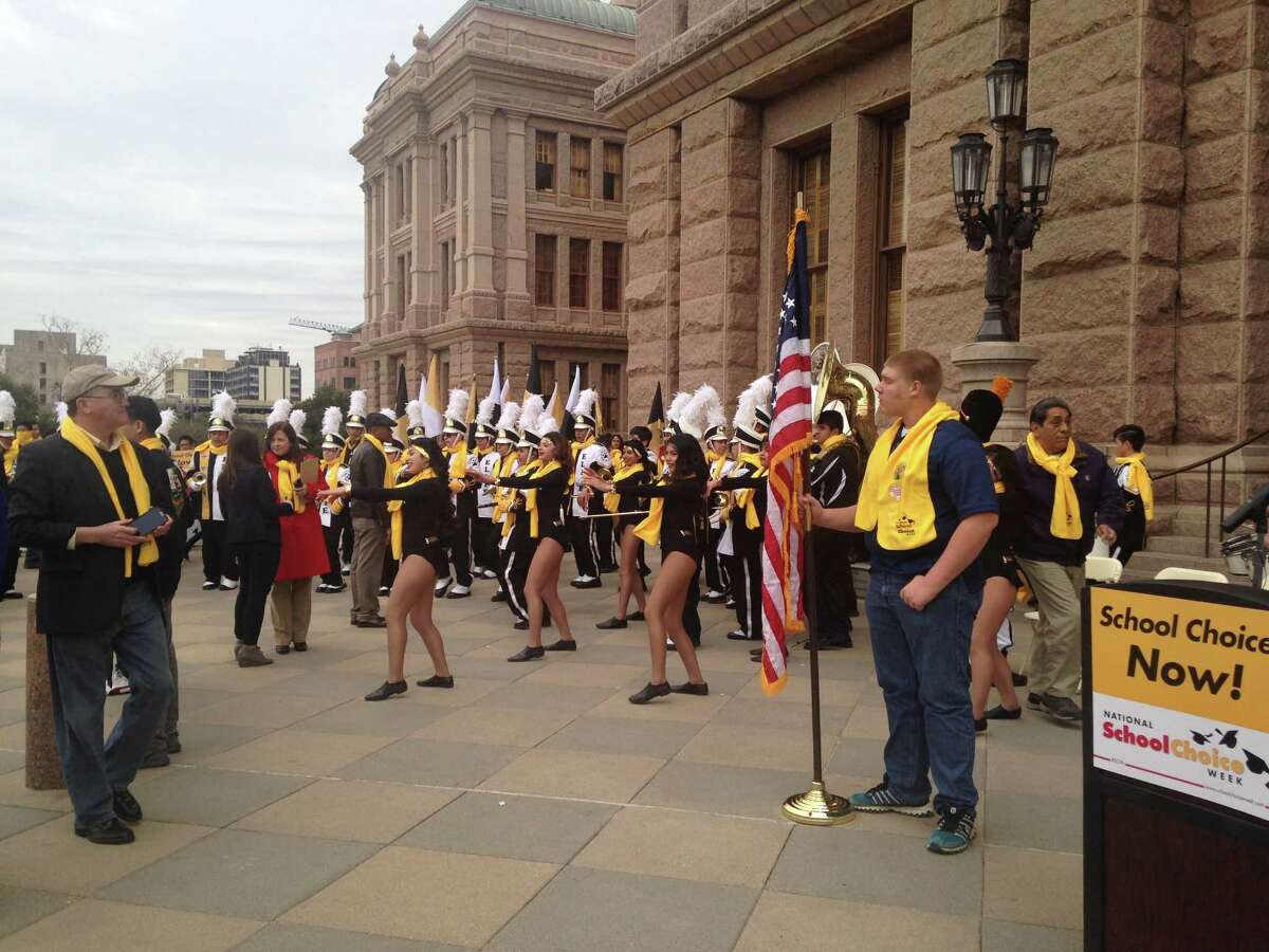 The Elite College Prep Cougar Marching Band plays at a school choice rally in Austin on Friday, January 30, 2015.