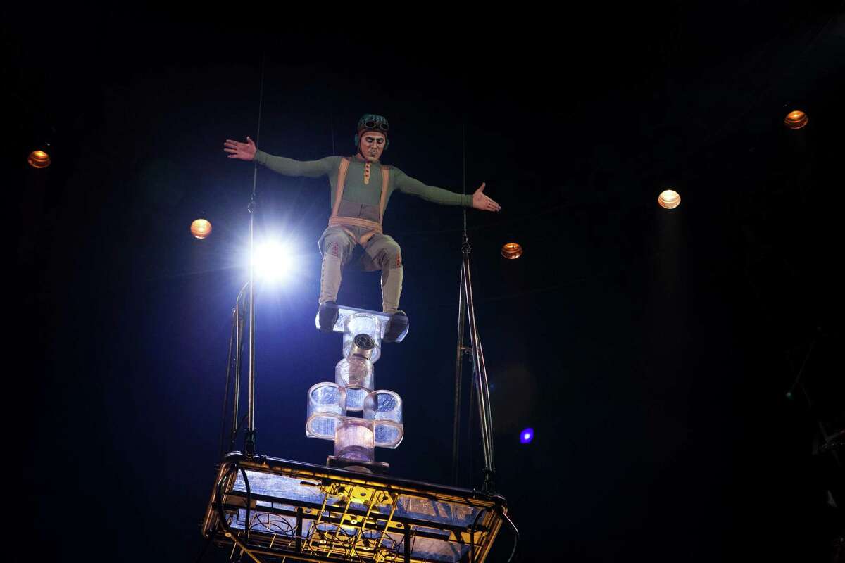 Suspended into the air, an aviator character performs roll bola at Cirque du Soleil's new show, "KURIOS - Cabinet of Curiosities", in Marymoor Park, Redmond on Thursday, January 29, 2015.