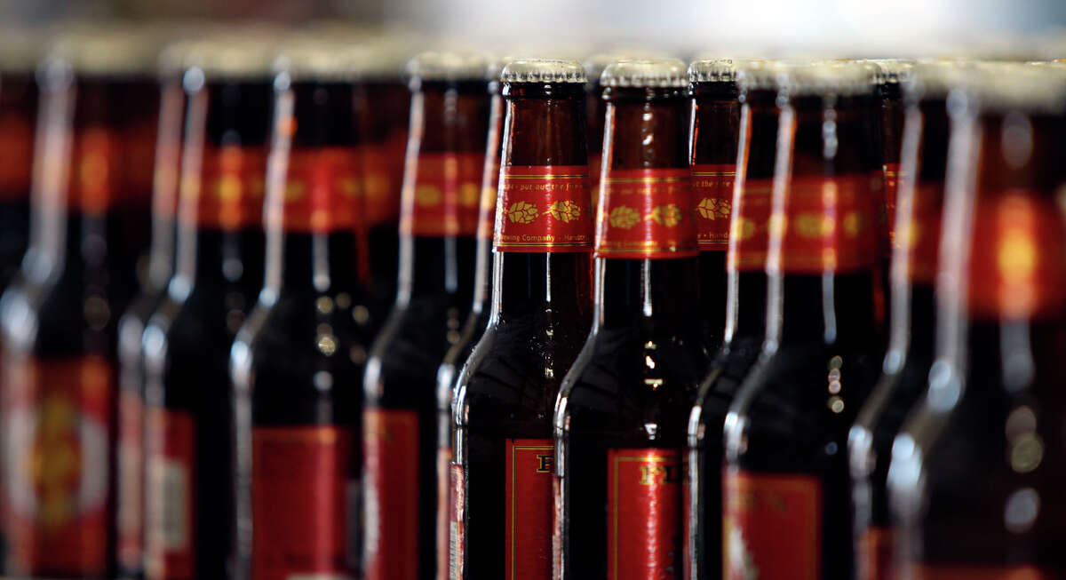 Bottles of Real Ale Brewing Co. beer are lined up and ready for packaging.