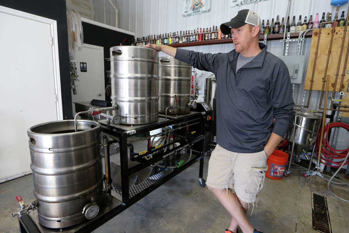 Seth Weatherly, owner and brewer of 5 Stones Artisan Brewery at 850 Schneider in Cibolo, stands beside some of his start-up brewing equipment.